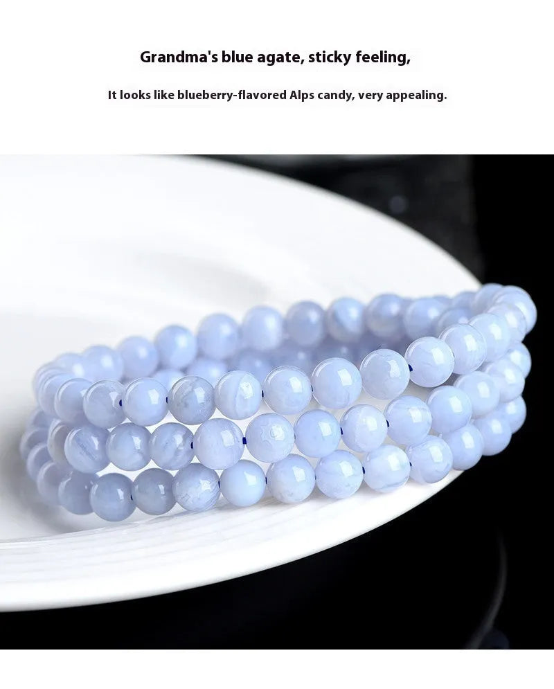 Blue agate beaded bracelet with striped patterning on 6-6.8mm beads in three circular strands