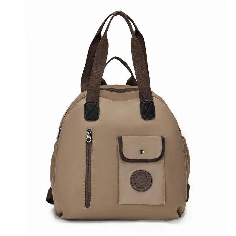 Outdoor lightweight large capacity nylon backpack in black, shown with sandwich pocket detail.