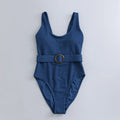 Navy blue women's one-piece swimsuit with triangle slimming design and removable chest pads