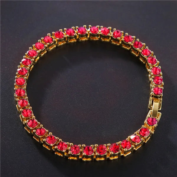 Men's silver geometric bracelet with a row of clear rhinestones and a gold tennis charm on a chain link.