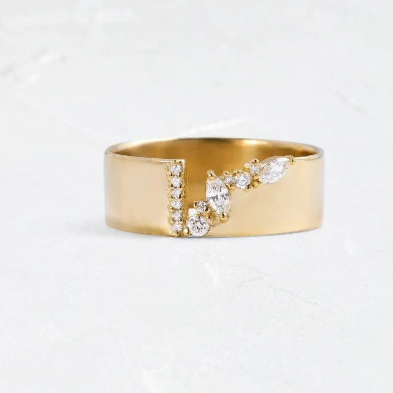 Gold electroplated copper ring with shining zircon stones on a finger.