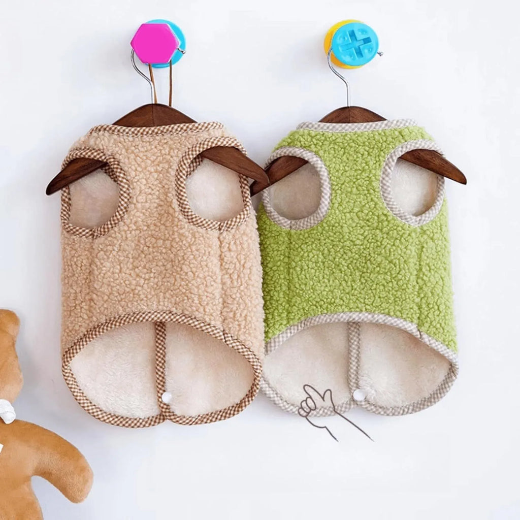 Green fleece dog vest with a metal leash ring on the back, for small pets.
