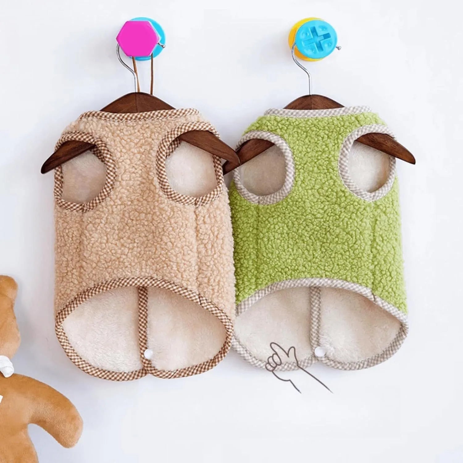 Green fleece dog vest with a metal leash ring on the back, for small pets.