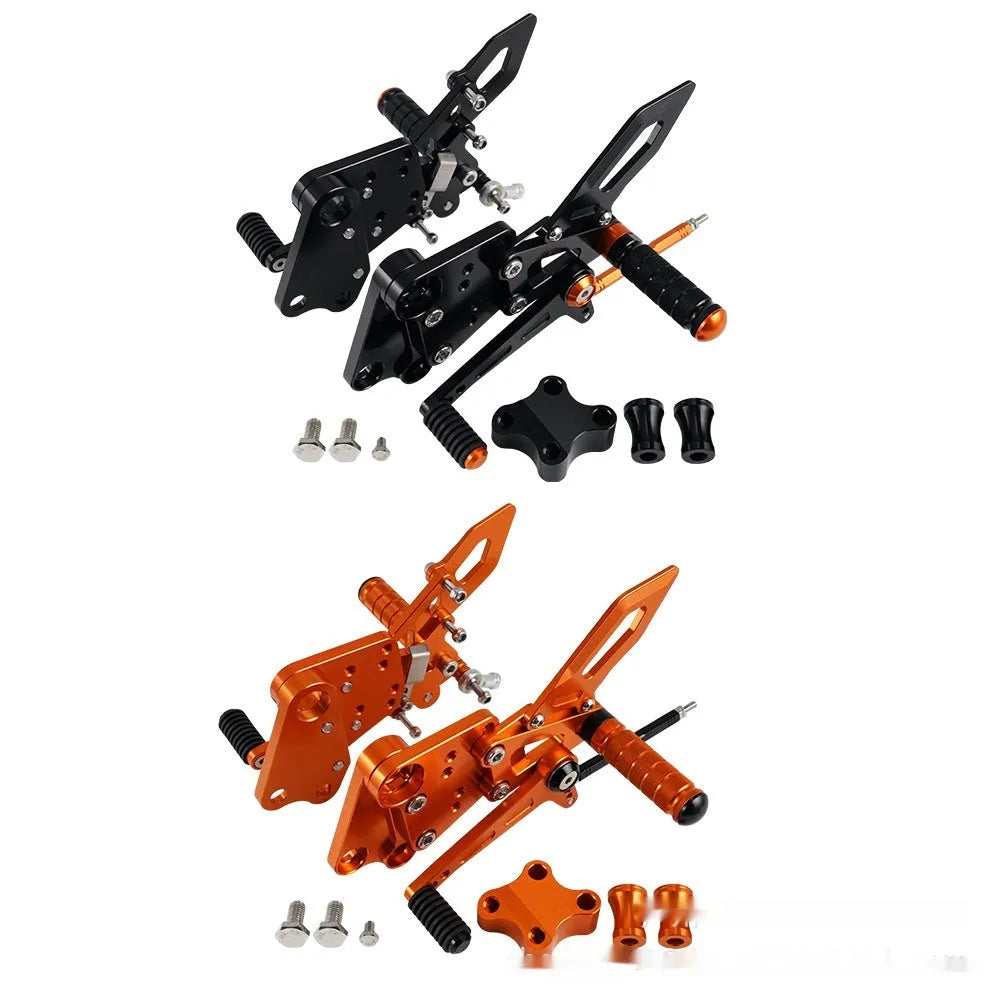 Black and orange KTM Duke motorcycle raised footrest bracket assembly