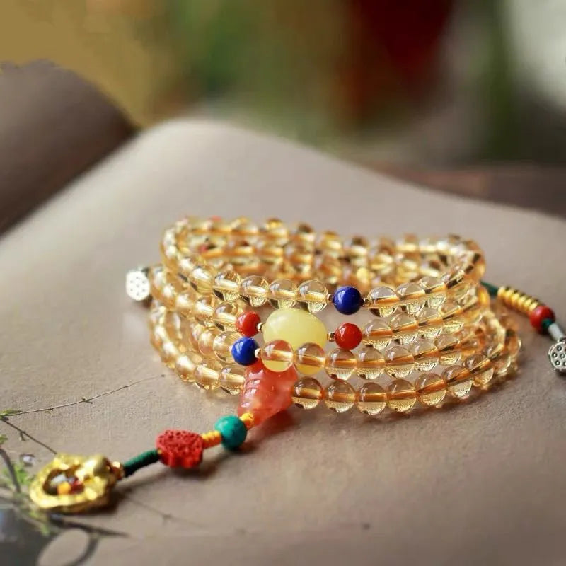 Natural Brazilian citrine bracelet with small 1mm red and yellow beads and filament accessories.