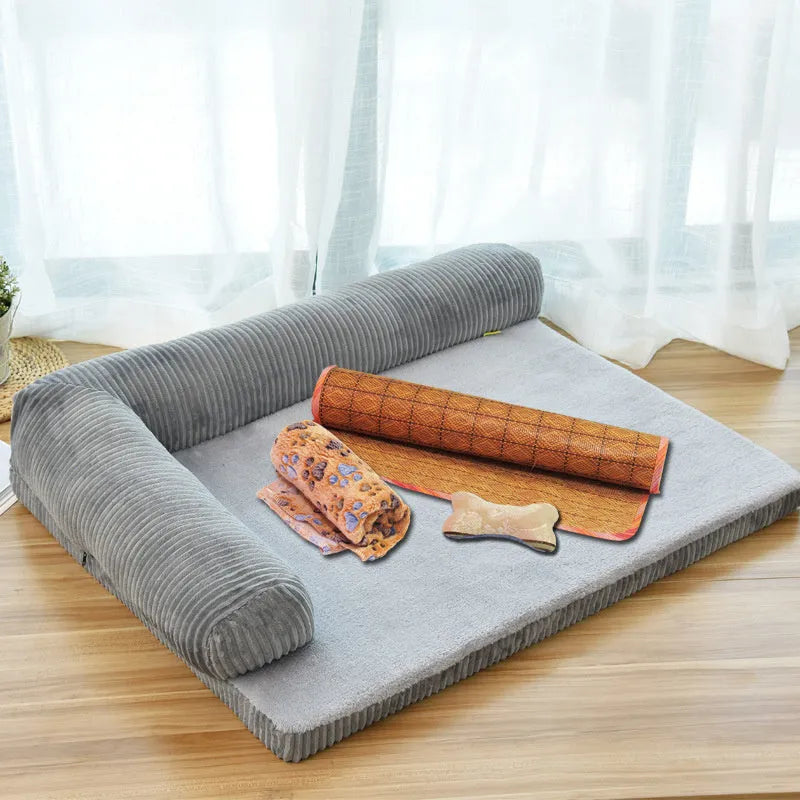 Corduroy bolster dog bed in grey colour with a non-slip base, shown in a large size for big dogs.
