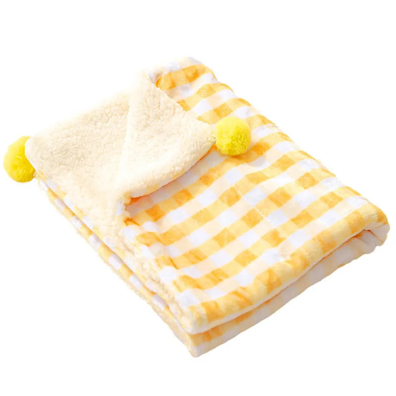 Blue coral fleece pet blanket shown in a large size next to a sleeping dog.