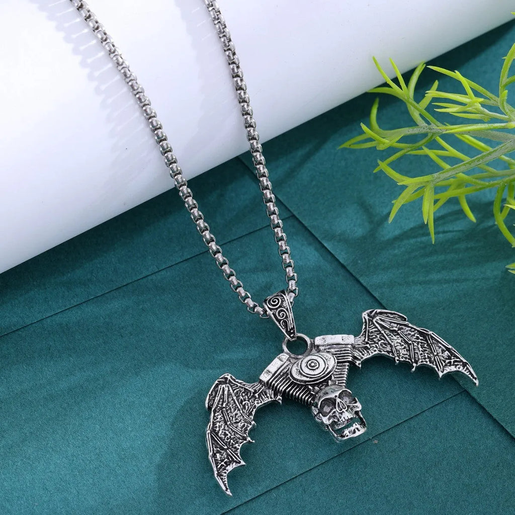 Gothic dark skull necklace with aluminium alloy skeleton wing pendant on dark background