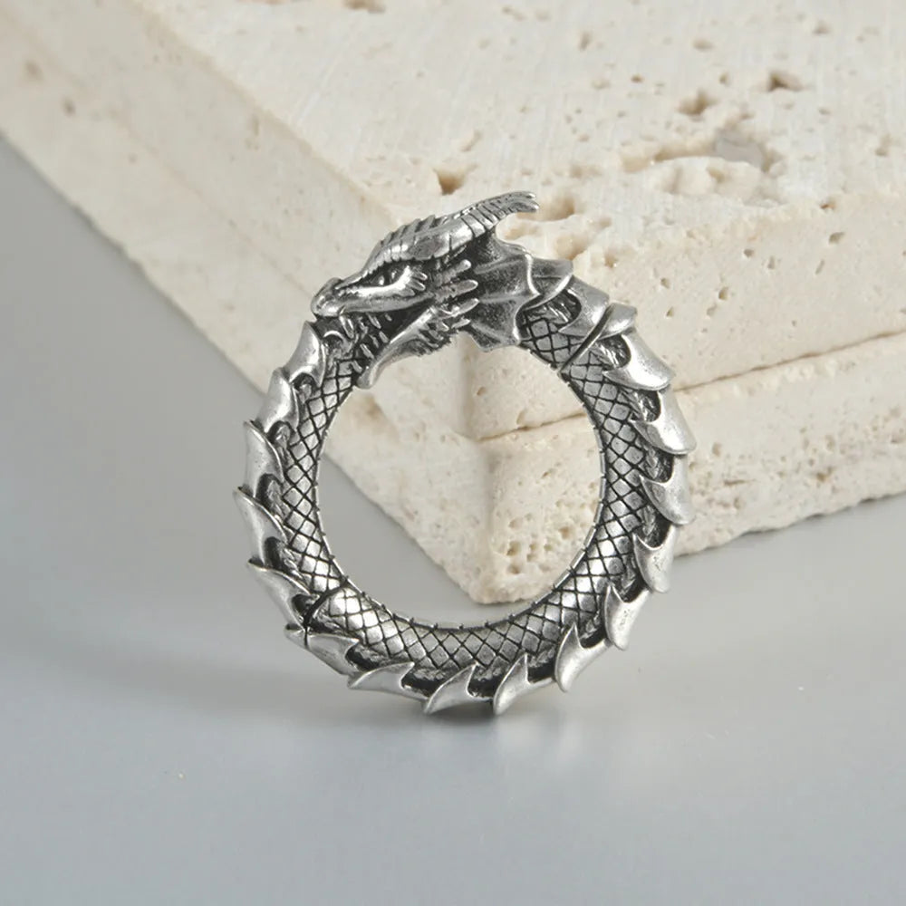Large geometric dragon-shaped hollow out earrings in antique silver finish.