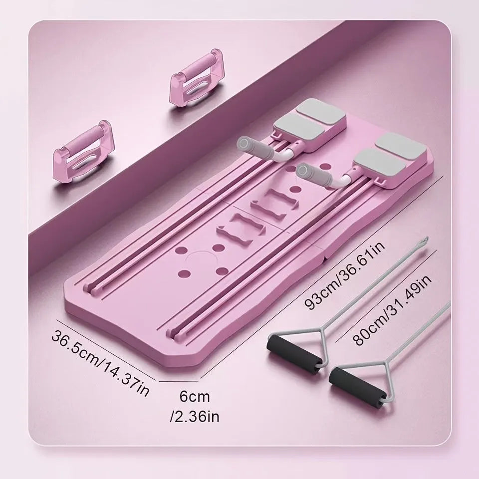 Pink portable abdominal exercise board with wheels on wooden floor