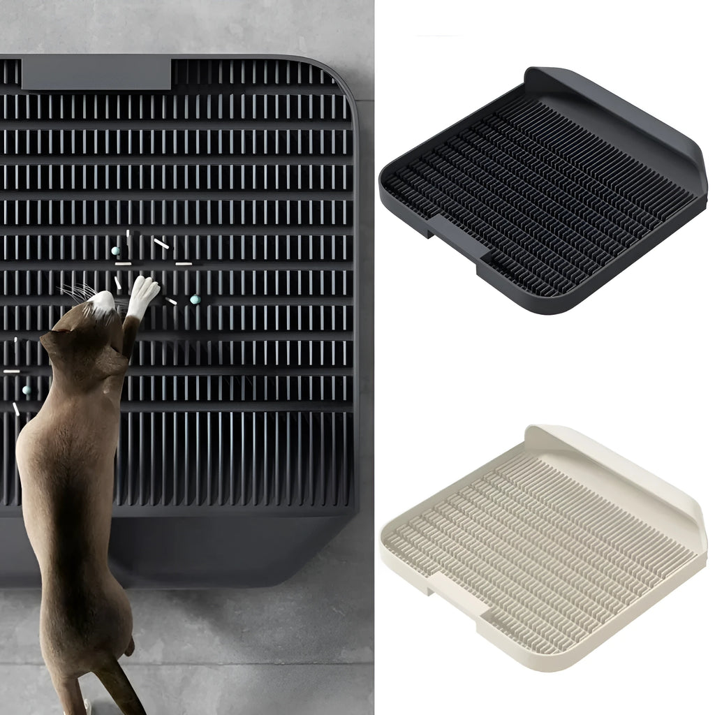 Large black cat litter pedal mat with textured grooves, placed next to a litter box.