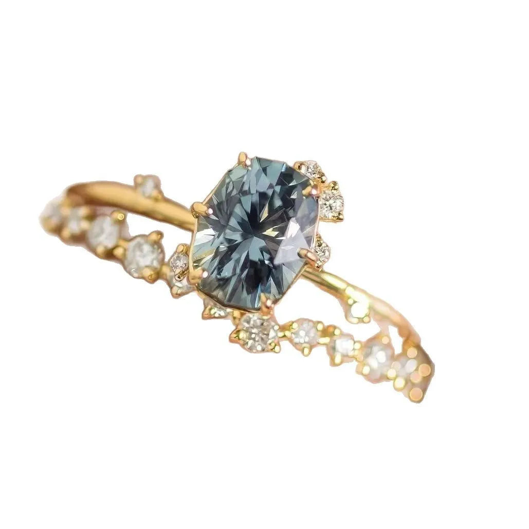 Gold-plated women's ring with green zircon centre stone in floral design showing couple set