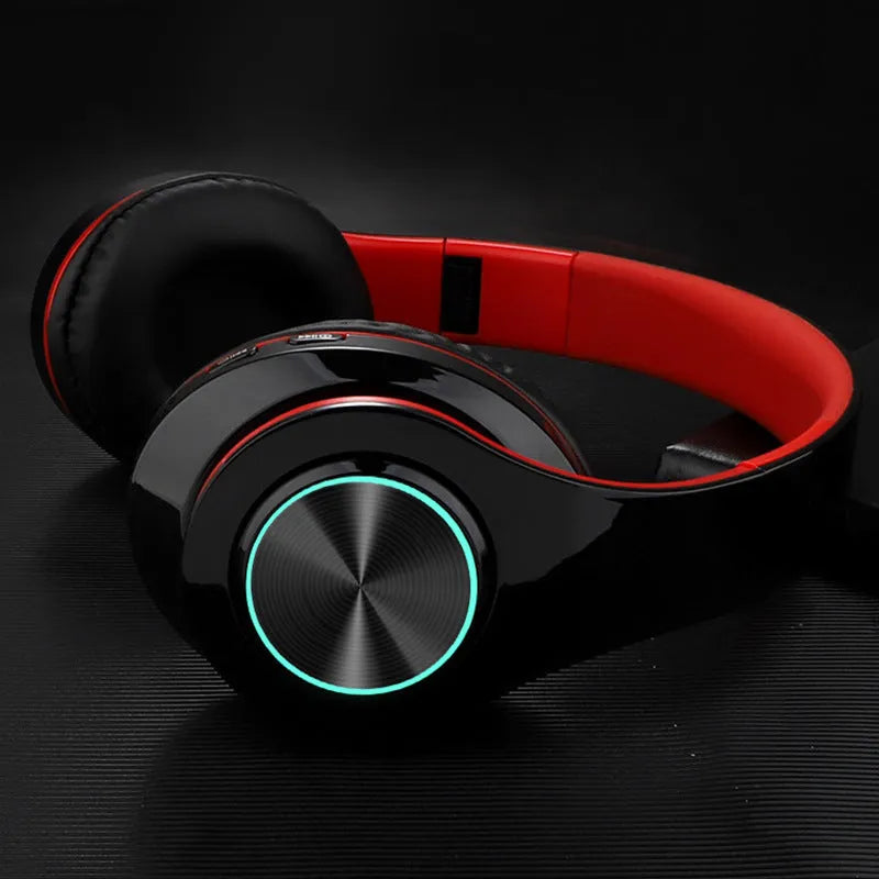 Wireless Bluetooth stereo headset shown in one of five colour options: black, blue, pink, red, or white.