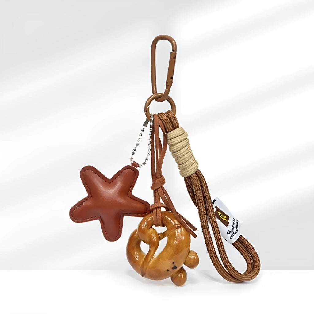 Handmade soda bread style handbag pendant with brown strap showing five design variations