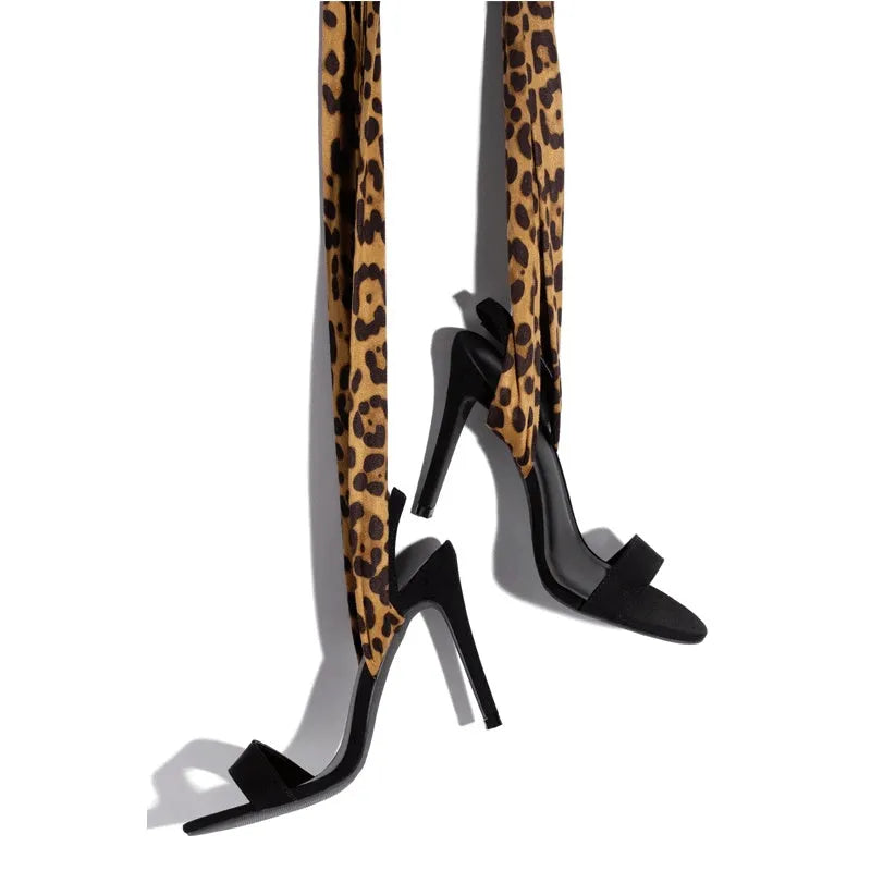 Light brown leopard print women's high heels with Roman cross straps and a thin high heel.