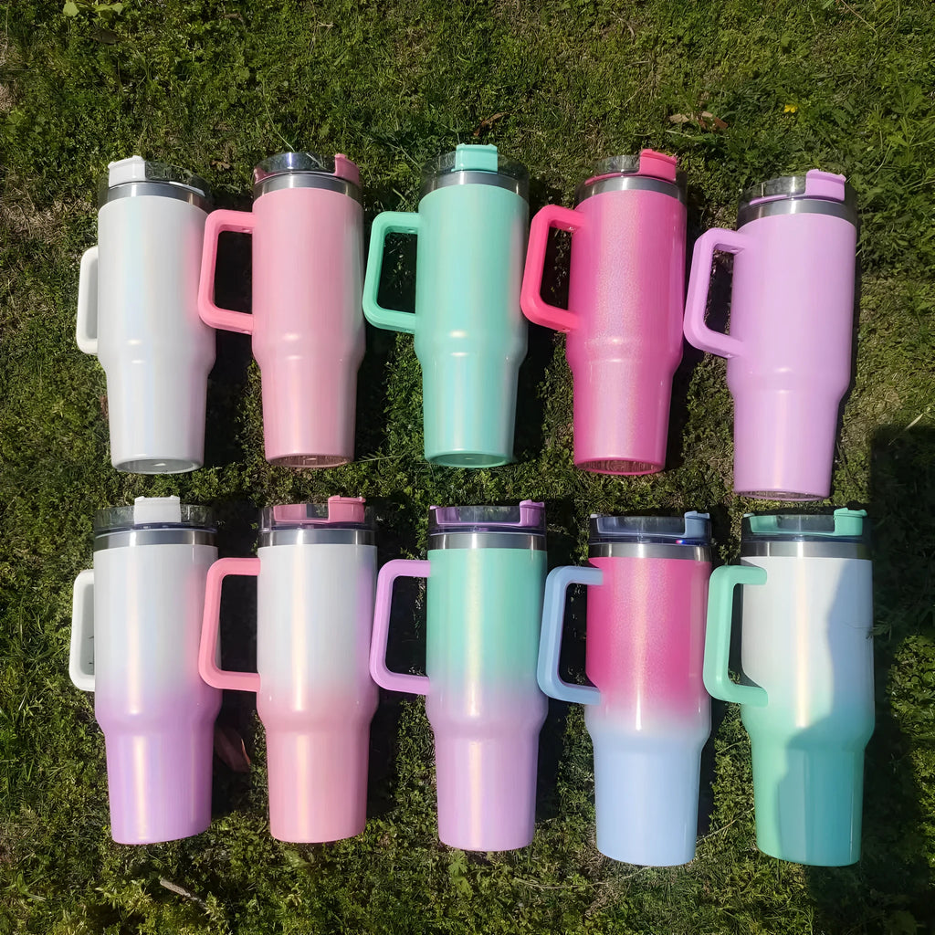 Large stainless steel vacuum insulation cup in a gradient colour, showing double-wall construction and 27.5cm height.