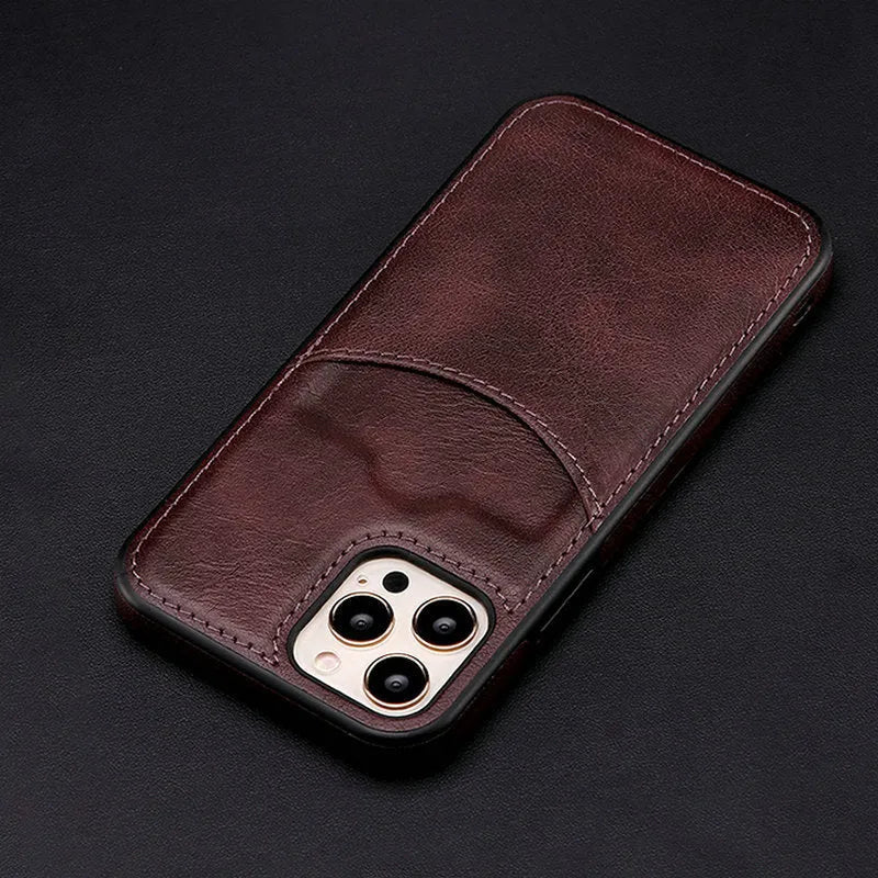 Dark blue PU leather protective case for iPhone mobile phones on a table.