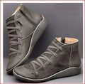 Women's casual flat ankle boots in various colours including black and leopard print, showing round toe and wedge heel.