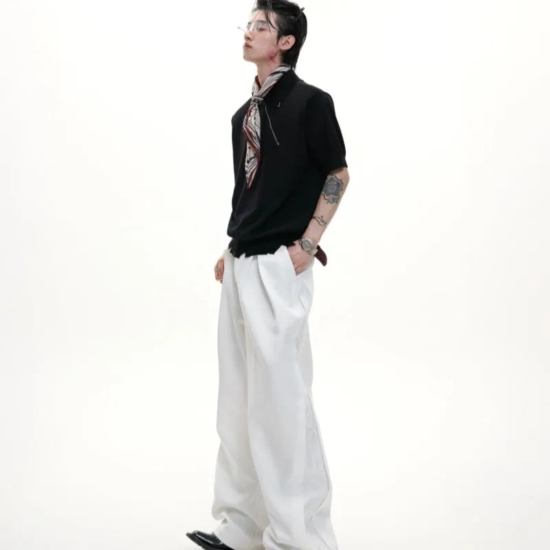 Men's slim-fit black knitted polo shirt with an oblique diagonal zip and short sleeves.