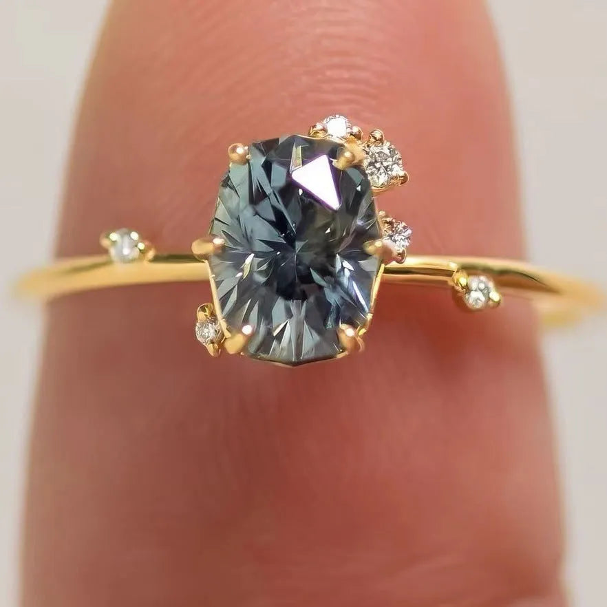 Gold-plated women's ring with green zircon centre stone in floral design showing couple set