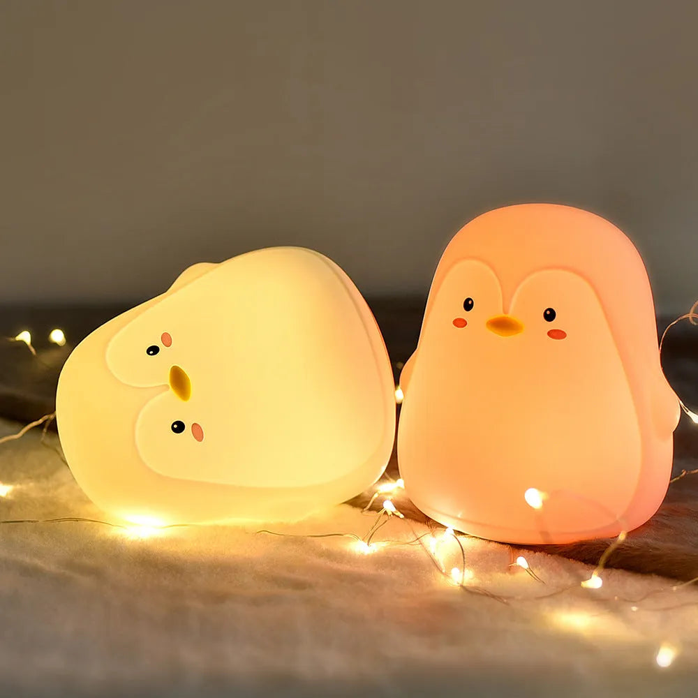 Penguin-shaped rechargeable night light with USB cable, white LED illumination, silicone ABS construction