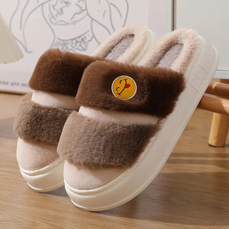 Cotton plush slippers with cashmere lining in a pink and green colour-block design, showing non-slip sole.