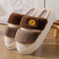 Cotton plush slippers with cashmere lining in a pink and green colour-block design, showing non-slip sole.