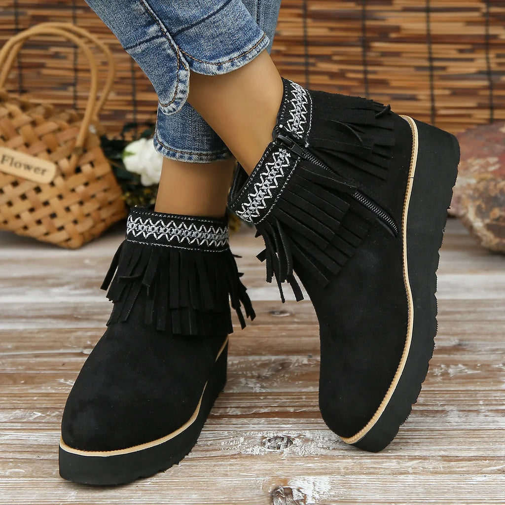 Women's dark brown suede wedge ankle boot with side zipper, tassel, and thick waterproof platform sole.