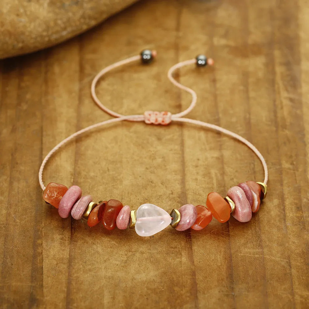 Handcrafted women's stone bracelet with geometric beads on a wrist.