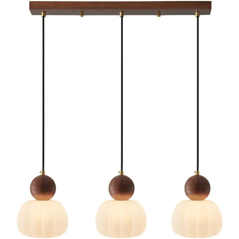 Creative pumpkin-shaped Nordic style ceiling chandelier in alloy, shown in single head and three head configurations.