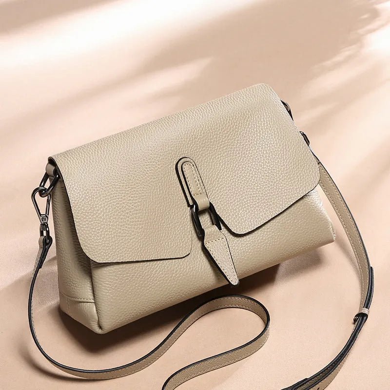 Women's soft first layer cowhide shoulder bag in black with adjustable strap and multiple pockets