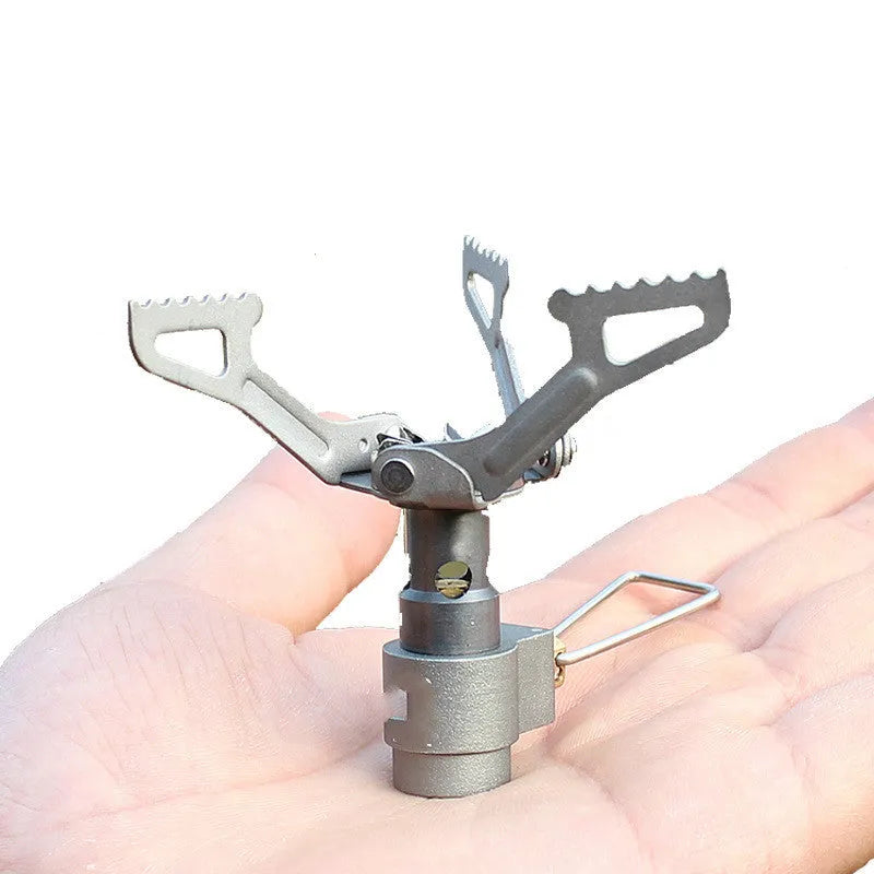 Portable propane gas camping stove with a one-piece furnace structure.