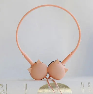 Cute cat stereo earphones with cat ear design in a choice of colours on a plain background
