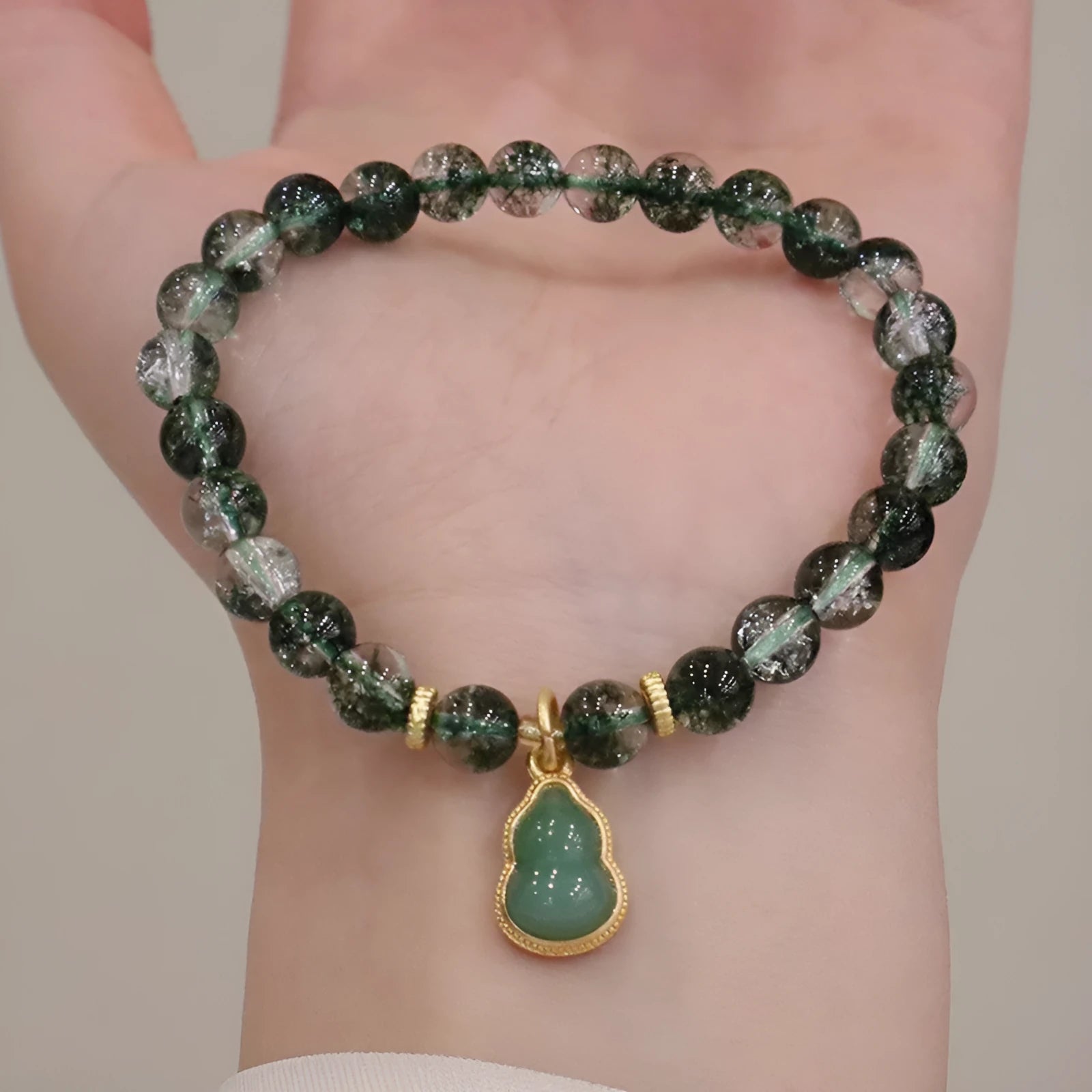Women's natural crystal bracelet with green phantom quartz heart pendant and pearl accents