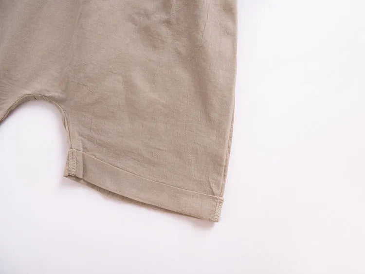 Children's khaki cotton overalls shorts with bow detail and straps, front view