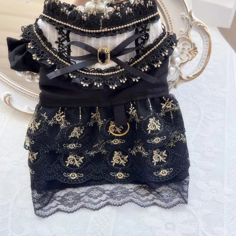Golden gothic princess skirt costume on a small dog, showing the pet clothing design.