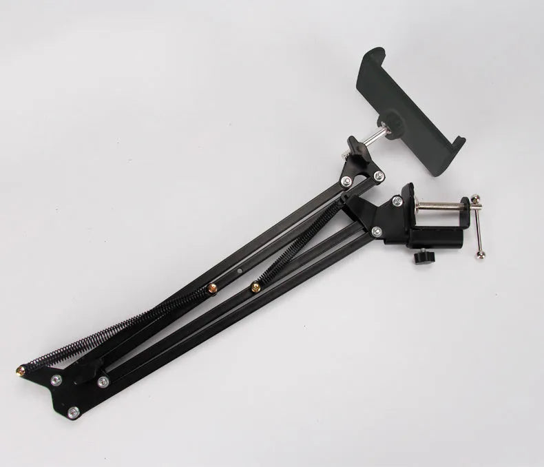 Adjustable phone and tablet stand in black and white colours on desktop
