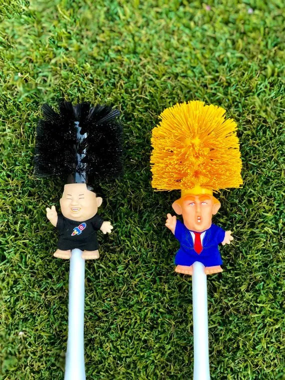 Yellow plastic Donald Trump novelty toilet brush with hanging handle, 40cm long