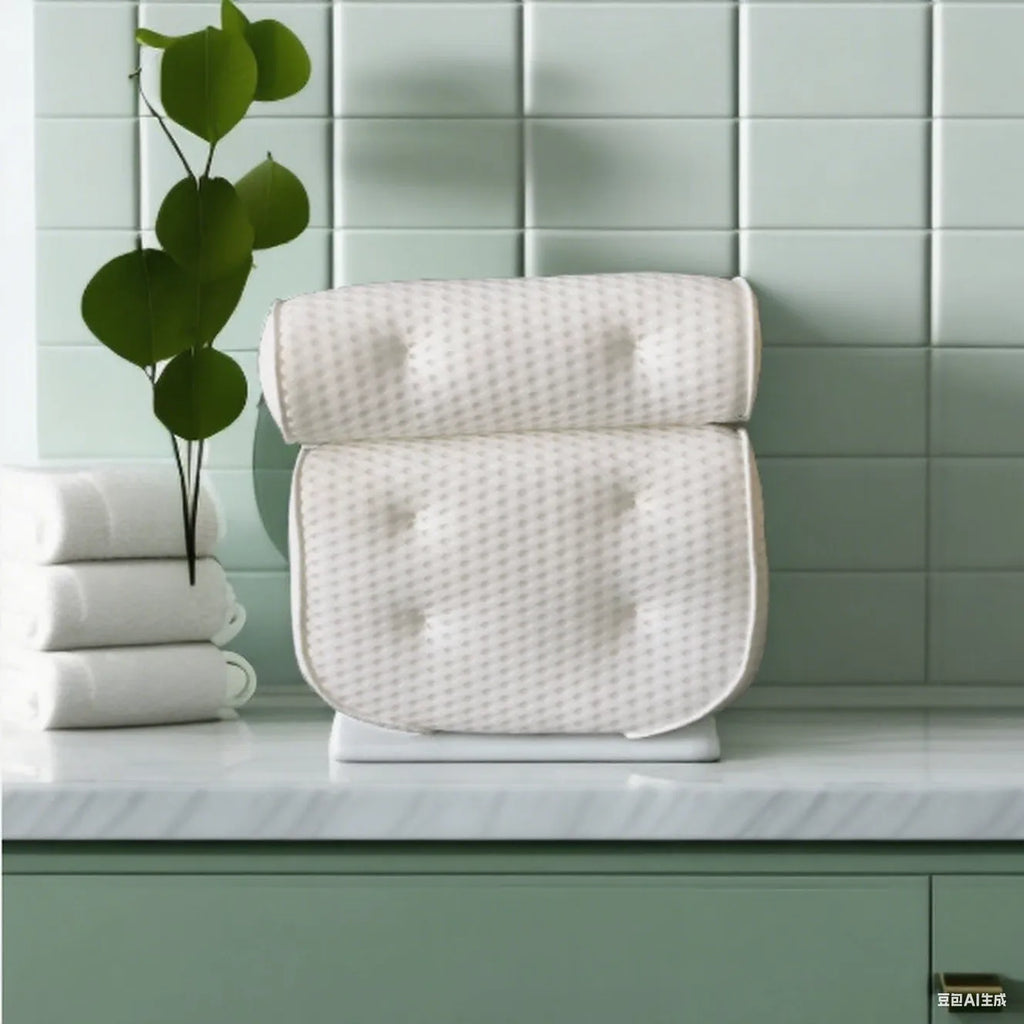 White bathtub pillow with mesh design and suction cups on underside