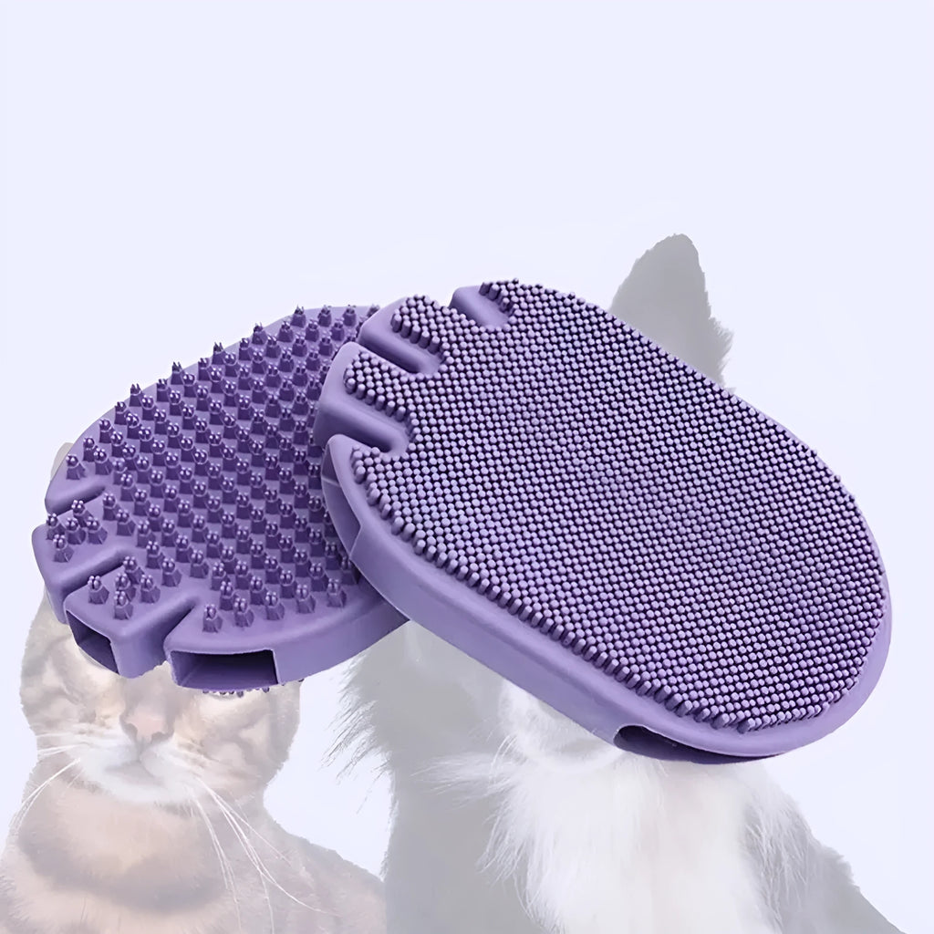 Purple dual-sided pet shampoo and massage brush with soft TPR bristles and ergonomic handle.