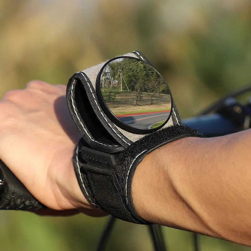 Black nylon bicycle rear-view mirror with wrist-style handlebar mount for cycling safety