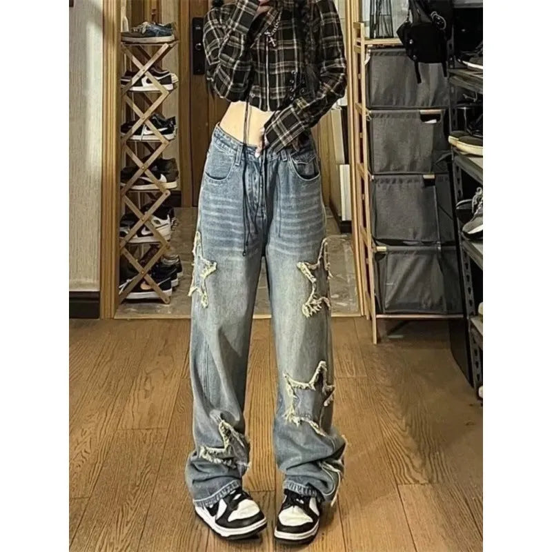 Blue high-waisted wide-leg cotton denim jeans laid flat.