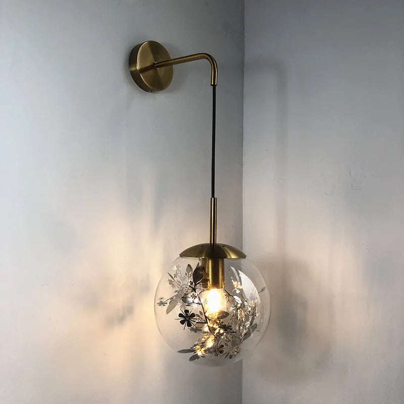 Modern glass wall lamp in golden flower or silver flower finish, shown in 15cm and 20cm sizes.