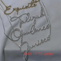 Personalised stainless steel name necklace with diamond-studded English letters on a chain.