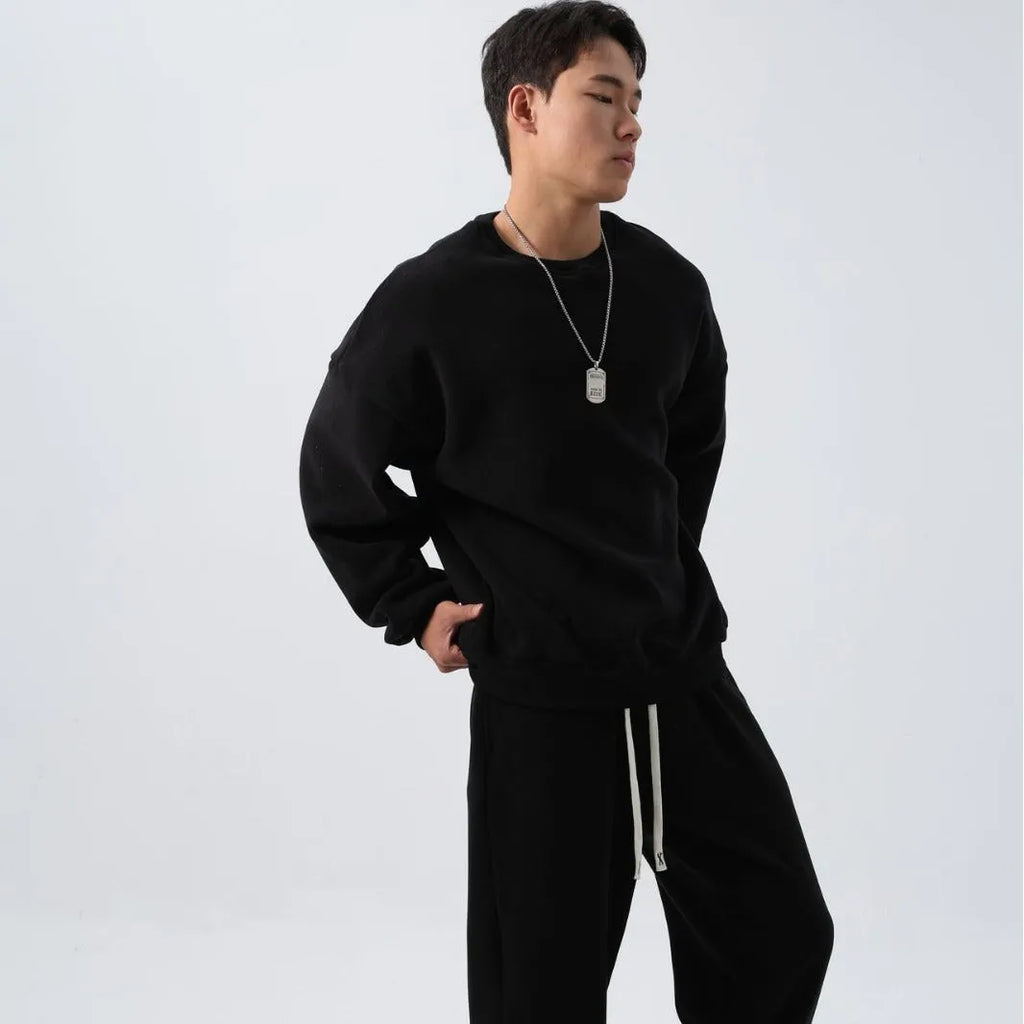 Men's polar fleece sports suit showing long-sleeved top and padded trousers in light grey colour