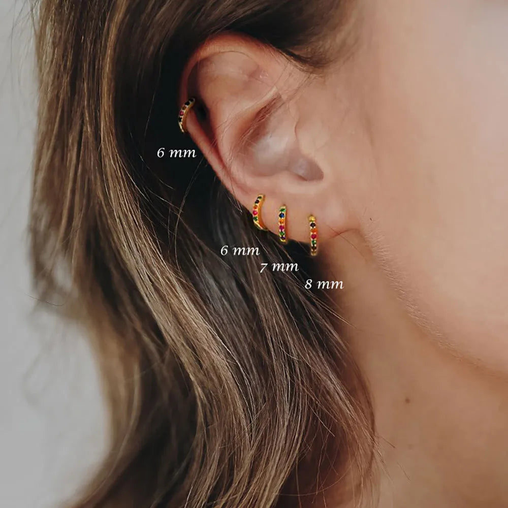 Zircon perforated stud earrings in gold, rose gold, or silver colour with geometric design