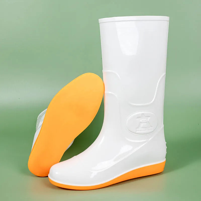 Plastic washable rain boots in white or yellow colours with high tube design and flat heel