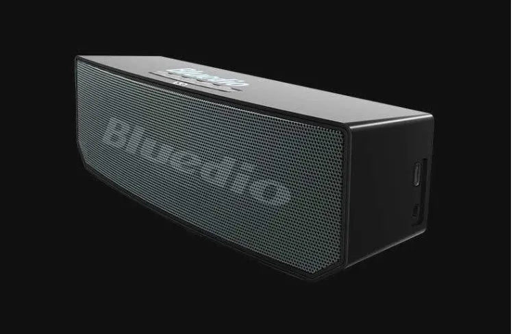 Black BS-6 cloud smart speaker showing front grill and control buttons.