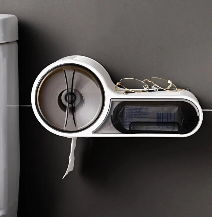 White plastic toilet roll holder with streamline curve design mounted on a bathroom wall.
