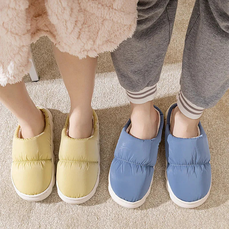 Blue down cotton slippers with thick rubber sole and plush lining, shown from side.